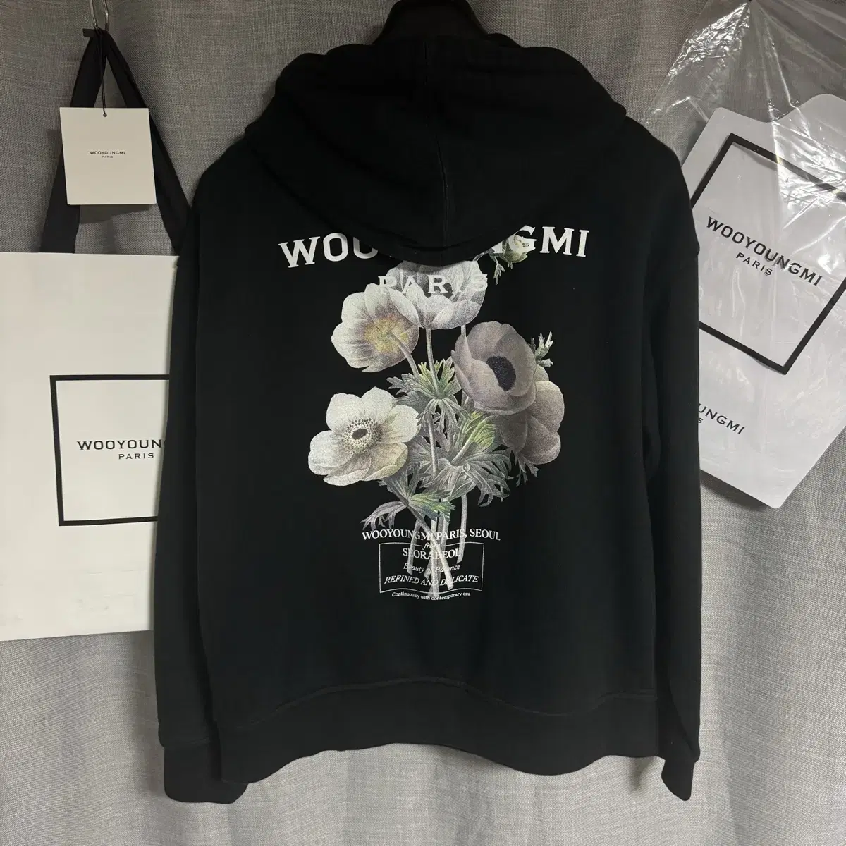 WOOYOUNGMI | 우영미 Wooyoungmi Flower Back Logo Hoodie Black WOOYOUNGMI | 우영미 Wooyoungmi Flower Back Logo Hoodie Black
